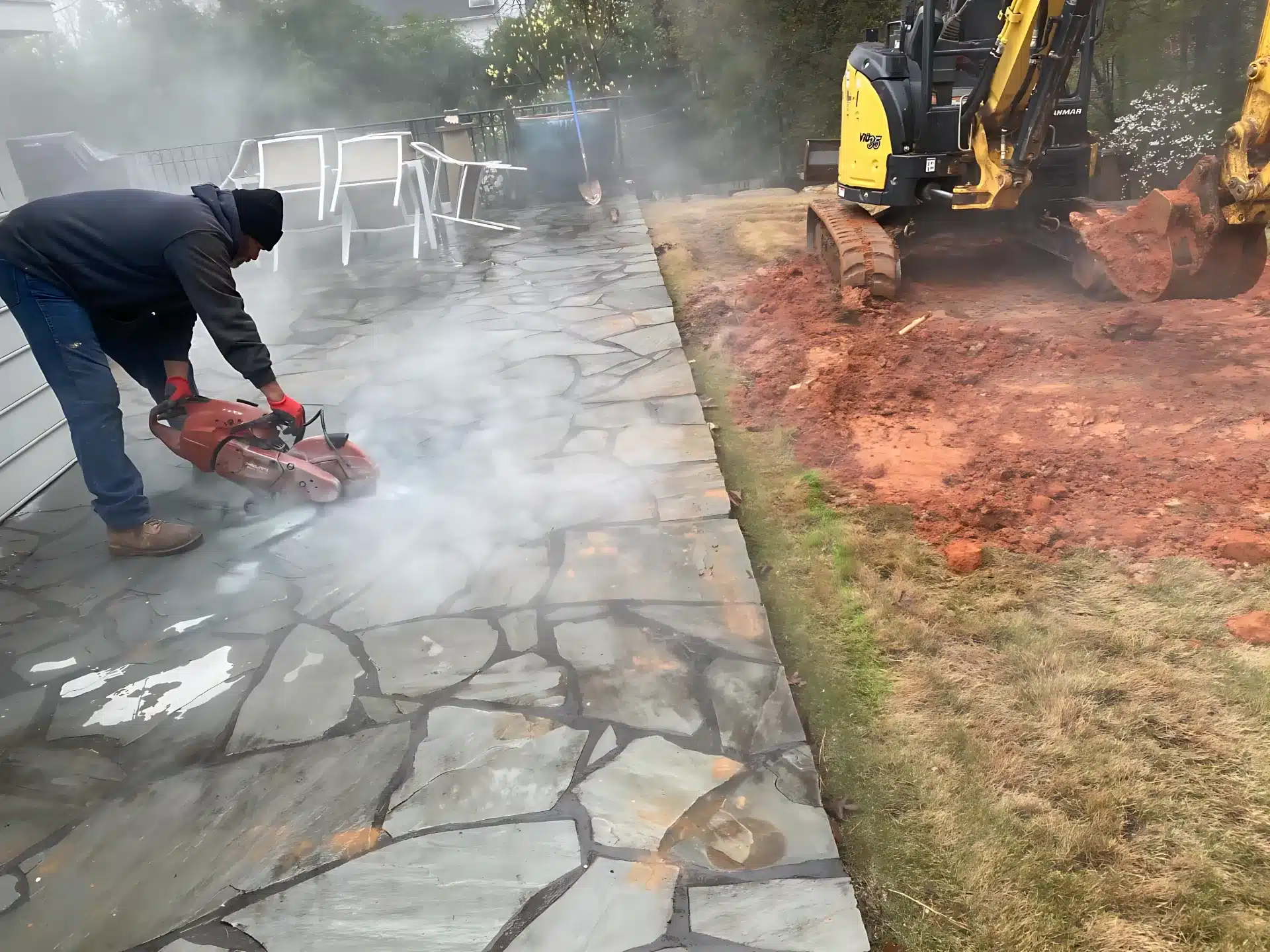 Cutting through a stone patio to reach a buried pipe – Plumbers 4 Real