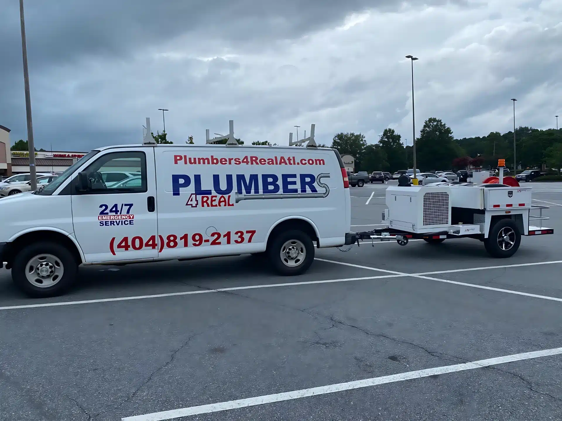 Truck and equipment trailer ready to roll – Plumbers 4 Real