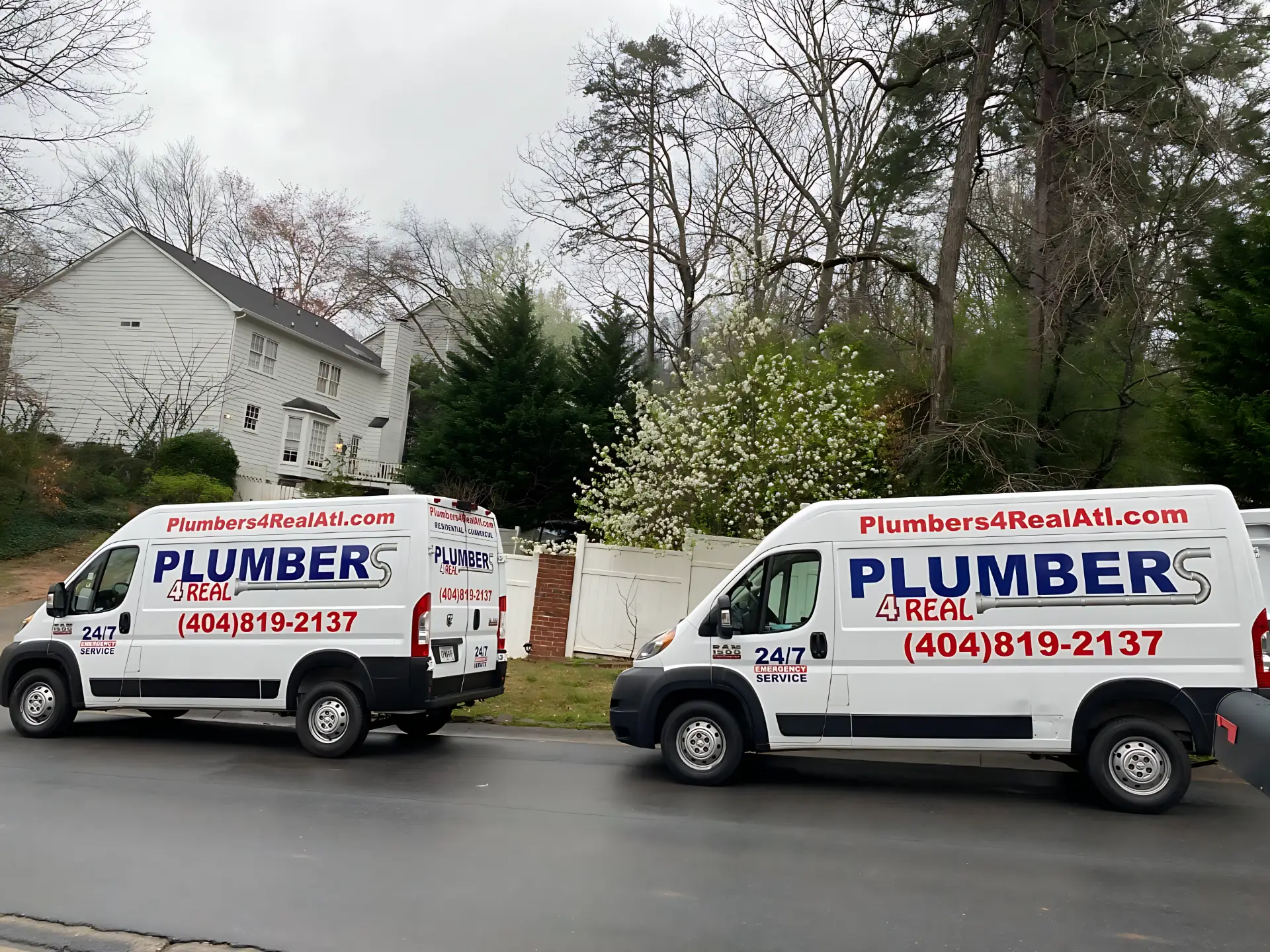 Two Plumbers 4 Real trucks on a residential call – Plumbers 4 Real